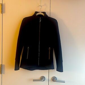Blk Ibex women's mid-heavy weight merino wool jacket w/ a zipper & knit accents.
